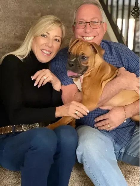 Melanie & David Martin, the family owners of The Ranch at Bonny Oaks, with one of their dogs